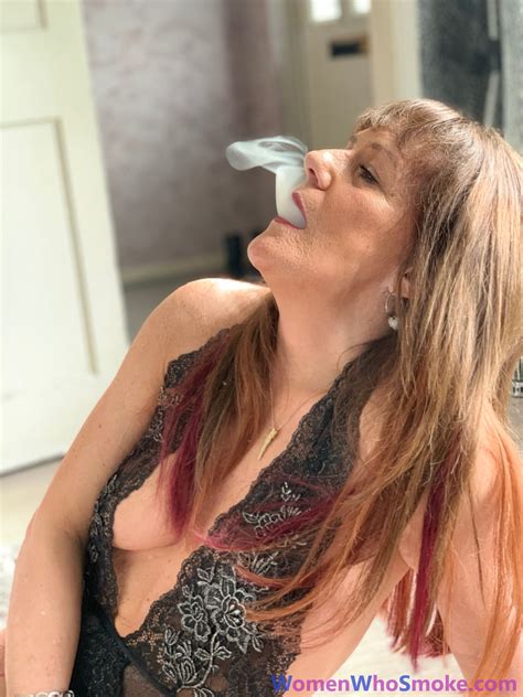 Badass Mature Woman Poses In Her Lingerie While Smoking A Cigarette CoedCherry