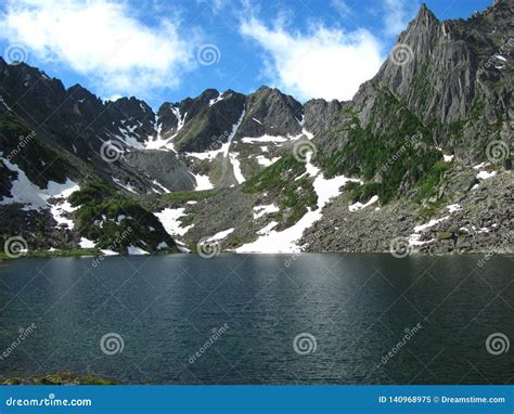 A Huge Lake Surrounded By Snowy Peaks Stock Image Image Of Glacier