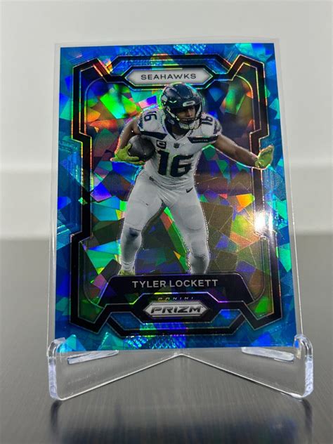 2023 Panini Prizm Blue Cracked Ice D 03 99 Tyler Lockett 264 Seattle