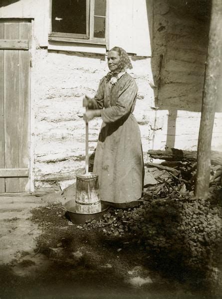 Woman With Traditional Dasher Churn For Making Butter Around 1905