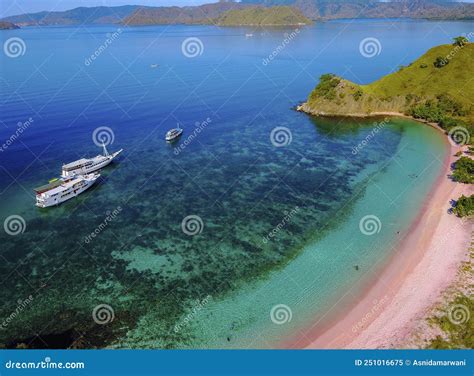 Aerial View of a Pink Beach in Flores, with a Tourist and a Yatch Stock ...