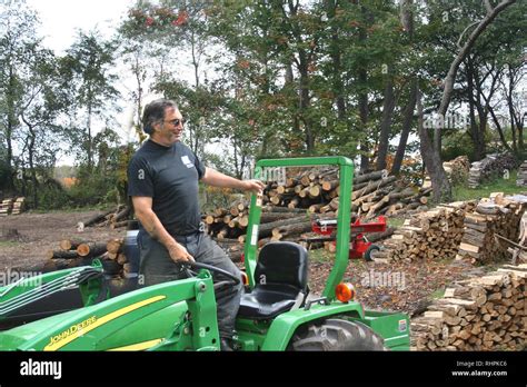 Cutting Splitting And Hauling Firewood Stock Photo Alamy