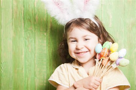 Premium Photo Portrait Of Smiling Girl Holding Leaf