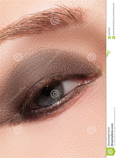 Close Up Of Blue Woman Eye With Beautiful Smoky Make Up Cosmetics