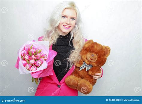 Tender Pretty Blonde Slim Teen Girl With Pink Flowers Cheerful Woman With Fresh Bouquet Stock