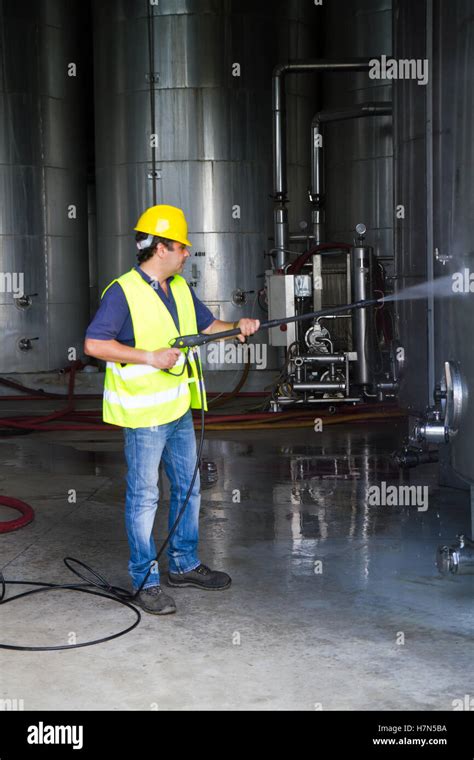 Worker Cleaning The Floor With A Pressure Washer Stock Photo Alamy