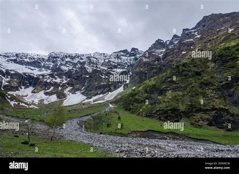 green valley with mountain and snow Stock Photo - Alamy