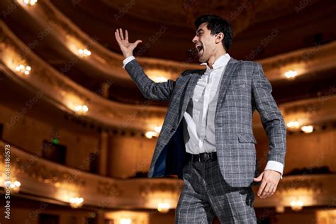 Professional Opera Singer In Elegant Classic Outfit Singing Hit With Open Mouth In Microphone