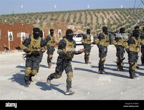 Elite fighters with the Kurdish YPG during training shown in a ...