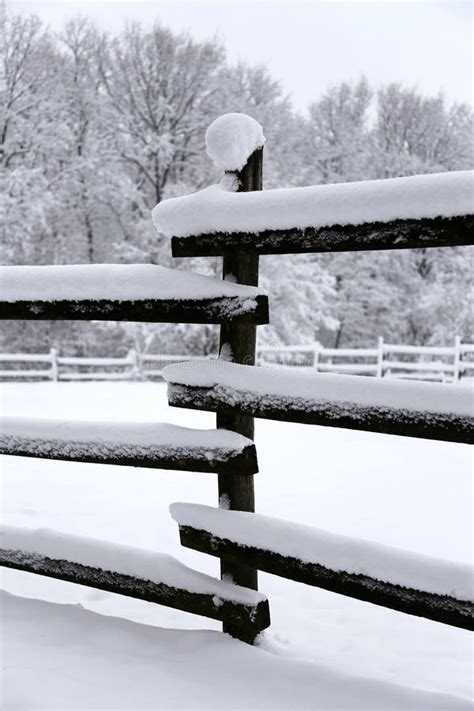 Fresh Snow Filled Corral Fences At Rural Winter Snowy Horse Farm Stock