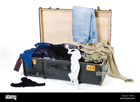 Open Suitcase With Messy Clothes On White Background Stock Photo Alamy