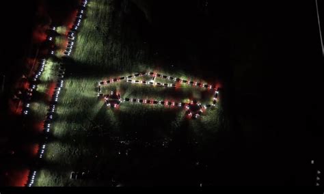 tesla owners hold stunning cybertruck inspired light show