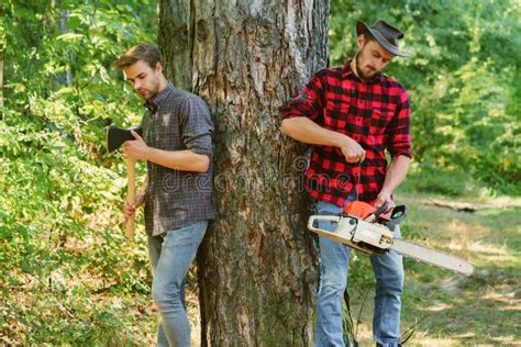 Two Friends Lumberjack Worker In The Forest Woodcutter With Axe And