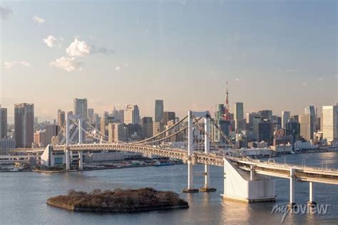 Sunset Of Tokyo Bay With Rainbow Bridge In Odaiba City Skyline