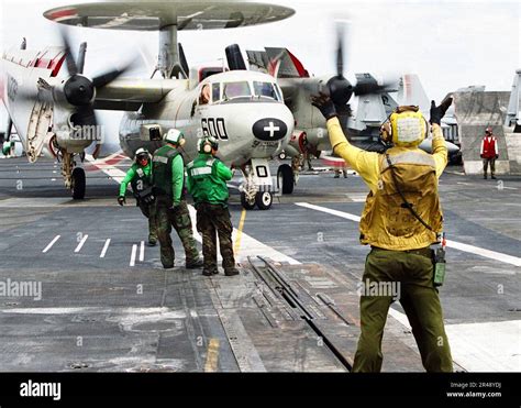 Us Navy An Aviation Boatswain S Mate Directs An E C Hawkeye Assigned