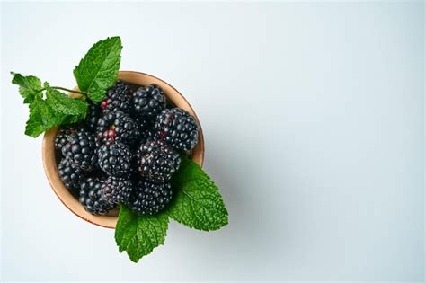 Premium Photo Blackberries In A Ceramic Bowl On A White Background