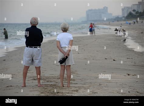 Florida Beach Scene With Mature Couple Stock Photo Alamy