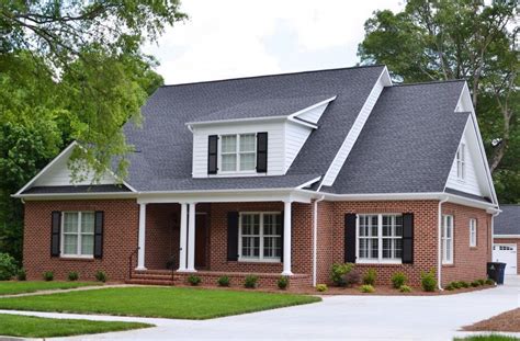 Red Brick House With Black Metal Roof - Sexy home