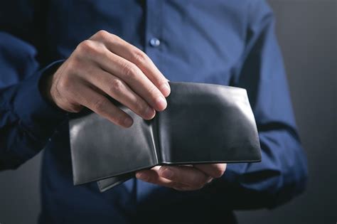 Premium Photo Man Holding Black Leather Wallet