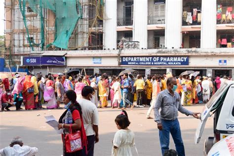 Crowd Group Of People Standing In A Row Outside Department Of Pharmacy