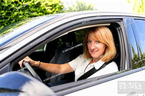 Smiling Mature Woman Driving Car Stock Photo Picture And Royalty Free