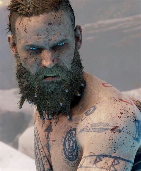 Bearded Man with Tattoos and Piercings in front of Icy Landscape