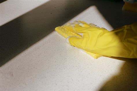 Hand In Yellow Rubber Glove Washing Surface Spring Cleaning Brown