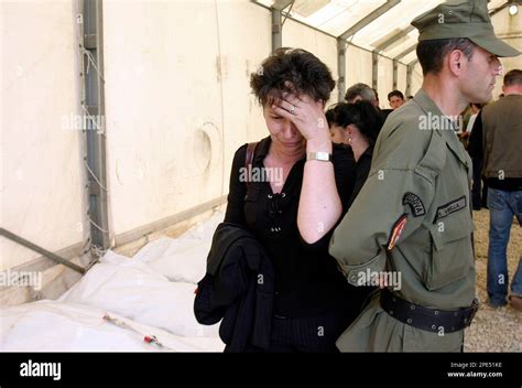 An Ethnic Albanian Relative Weeps After She Looked At Bodybags With