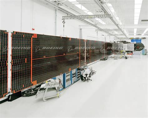 Boeing Images First Boeing 702 Satellite With New Solar Array Design