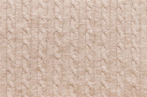 Premium Photo | Beige knitted fabric background