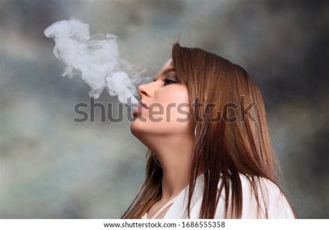 Attractive Brunette Girl Posing Studio Smoking Stock Photo Edit Now 1686555358