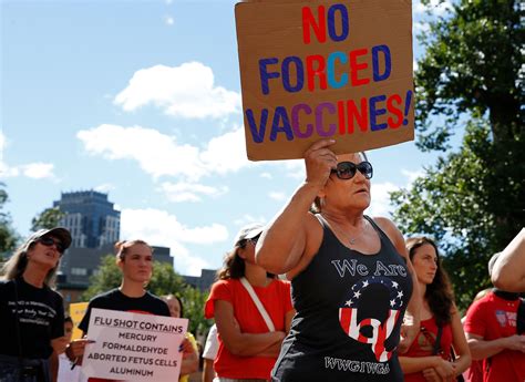 PHOTOS: Activists take shots at Gov. Baker at rally to protest