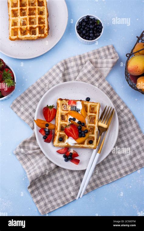 Waffles with berries and fruit Stock Photo - Alamy