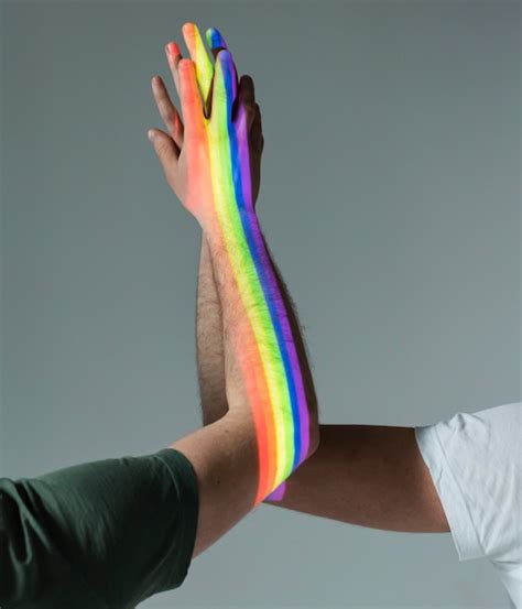 Free Photo Men Holding Hands With Pride Symbol