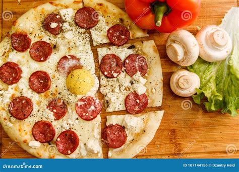 Fresh Pizza With Tomatoes Cheese And Mushrooms On Wooden Table Closeup