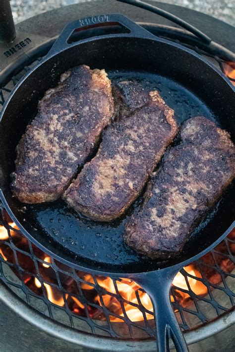 New York Strips with Bourbon Mushrooms - Over The Fire Cooking