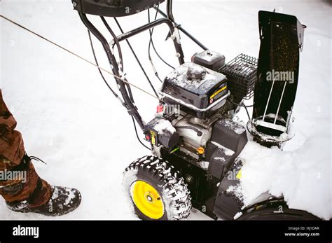 Man Starts The Engine Snow Blower Stock Photo Alamy