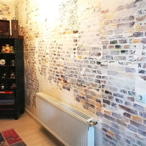 A Room With A Brick Wall And Radiator