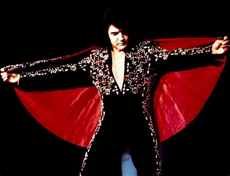 Elvis Closing The Show With His Cape Opened Wide In The Black Conquistador Jumpsuit In 1972