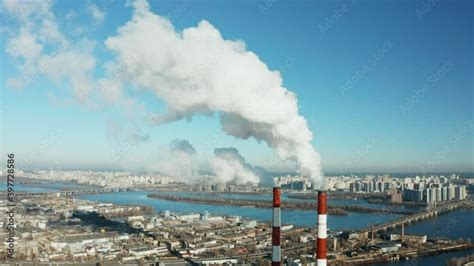 Epic Aerial Of High Smoke Stack Plant Pipes Pollute Atmosphere