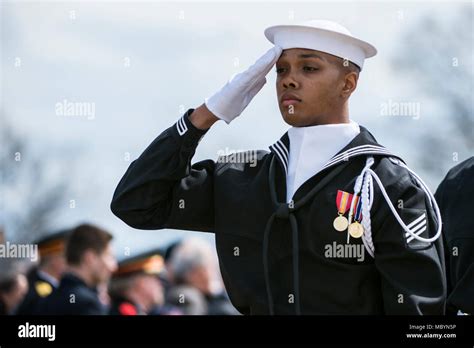 A Sailor From The U S Navy Ceremonial Guard Renders Honors During The