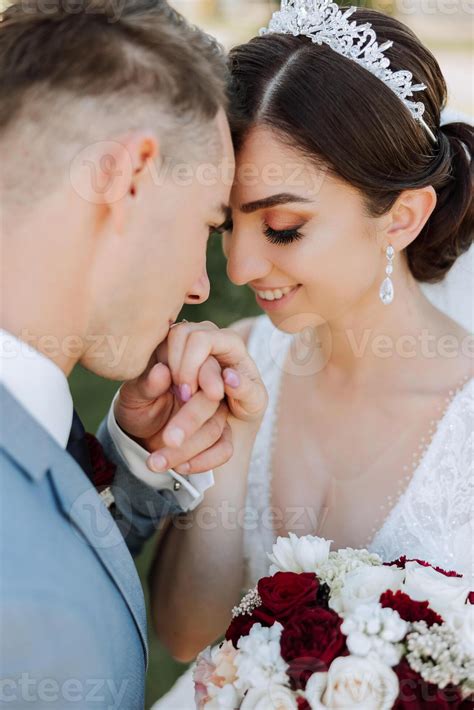 The Groom Kisses The Bride S Hand Wedding Photo Of A Couple In Love A