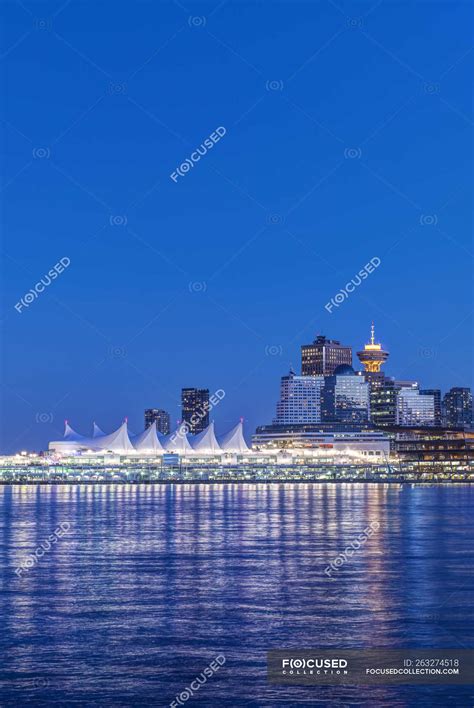 Waterfront skyline illuminated at night, Vancouver, British Columbia ...