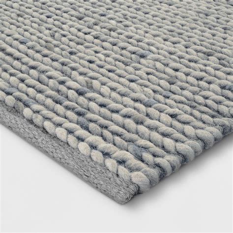 Add A Touch Of Softness And Modern Style To Your Room With This Chunky Knit Braided Wool Rug