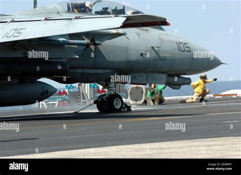 US Navy Lt Cmdr Gives The Launch Signal To An F 14D Tomcat Assigned