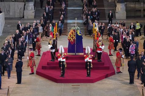 The Queen Royal Guard Suddenly Collapses Standing Guard Over Coffin