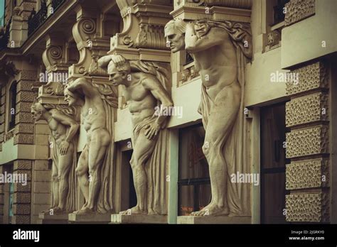 The house with four Atlantes of St. Petersburg. Statues of the four ...