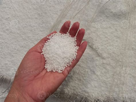 Urea Chemical Fertilizer White Foam Granules Agglomerate In The Hands