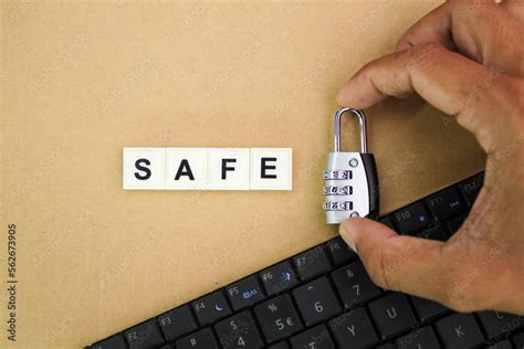 laptop keyboard, holding the key with the alphabetic word safe. cyber ...