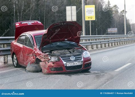 A Maroon Volkswagen Passat Car Wrecked In An Accident On Simferopol